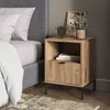 A bedside table next to a bed in a bedroom setting. Voir les images du produit