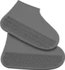 A pair of gray shoe covers with a textured sole. Náhľad obrázku produktu