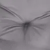 A close-up view of a gray tufted cushion, showing the texture and stitching. Produktbild-Vorschau