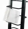 A close-up shot of transparent CD cases on a black metal rack. Náhled obrázku produktu