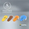Four hearing aid batteries with different colored tabs are displayed on a gray background, along with text indicating guaranteed shelf life. Voir les images du produit