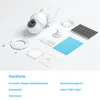 A product shot of a security camera and its accessories laid out on a white and light gray surface. Produktbild-Vorschau