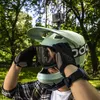 A person wearing a helmet and goggles, preparing for an outdoor activity. Náhľad obrázku produktu