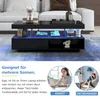 A modern living room scene featuring a black coffee table with LED lighting, showcasing its functionality for work and relaxation. Anteprima dell’immagine prodotto