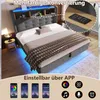 A bed with LED lighting and a nightstand in a room. Produktbild-Vorschau