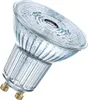 A close-up studio shot of a single LED light bulb with a GU10 base. Voir les images du produit