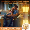 A couple relaxing on a couch next to a floor lamp. Produktbild-Vorschau