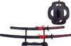A set of two decorative Japanese swords (Katana and Wakizashi) displayed on a black stand, with a sword guard shown separately. Voir les images du produit