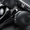 A close-up shot of black in-ear headphones with metallic accents. Produktbild-Vorschau