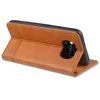 A brown leather phone case is shown from a side-angle, with the phone inserted and the front cover folded back to act as a stand. The camera module of the phone is visible. Produktbild-Vorschau