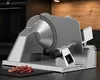 A slicer on a countertop with sliced meat. Anteprima dell’immagine prodotto