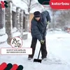 A person is shoveling snow on a sidewalk in winter. Podgląd zdjęcia produktu