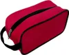 A red toiletry bag with a black zipper and trim, shown from a slightly elevated side angle on a white background. Náhled obrázku produktu