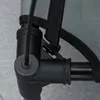 Close-up of a black plastic corner joint connecting metal poles, with gray fabric and black straps visible. Podgląd zdjęcia produktu