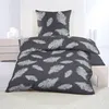 A bed with a duvet and pillow featuring a feather pattern. Produktbild-Vorschau
