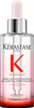 A bottle of Kérastase Genesis serum with a dropper. Produktbild-Vorschau