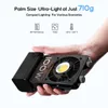 A hand holding a compact LED light. Produktbild-Vorschau
