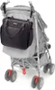 A black diaper bag is attached to the handles of a gray stroller. Produktbild-Vorschau