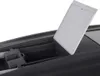 A close-up view of an open compartment with a lid ajar. Podgląd zdjęcia produktu