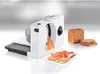 A white electric slicer is shown with sliced ham in front and a loaf of bread to the side. Voir les images du produit