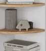 Corner shelves with decorative items and books. Anteprima dell’immagine prodotto