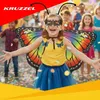 A young girl dressed in a butterfly costume, with wings and a mask, is smiling and posing for a photo during a celebration with confetti falling. Produktbild-Vorschau