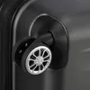 A close-up view of a black suitcase wheel. Produktbild-Vorschau
