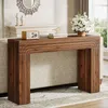 A wooden console table with decorative items on top, placed in a living room setting. Anteprima dell’immagine prodotto