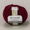 A ball of burgundy yarn with a label attached. Podgląd zdjęcia produktu