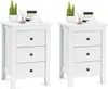 Two white nightstands are shown against a white background, each with three drawers and decorated with small potted plants and decorative items. Produktbild-Vorschau