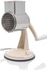 A beige and silver rotary grater with a crank handle and a suction base, isolated on a white background. Produktbild-Vorschau