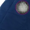 A close-up of a blue weighted blanket with a circular inset showing small clear beads. Produktbild-Vorschau