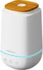 A white aroma diffuser with a wooden top, featuring a blue LED light ring around its base. Produktbild-Vorschau