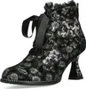 A single black ankle boot with a floral pattern and lace-up front, shown against a white background.