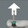 A hand wearing a white glove is holding a screwdriver bit with a green and black handle. An upward-pointing white arrow is superimposed on a gray background. Anteprima dell’immagine prodotto