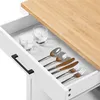 A close-up view of an open kitchen cart drawer, showing cutlery and glasses. Produktbild-Vorschau