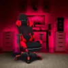 A gaming chair in a room with red ambient lighting. Voir les images du produit