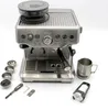 A silver espresso machine with accessories on a white background. Produktbild-Vorschau