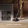 A person is using a wet and dry vacuum cleaner in a kitchen-like setting. There are informational overlays on the left side of the image. Produktbild-Vorschau