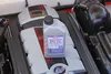 A bottle of coolant is placed on top of an engine. Produktbild-Vorschau