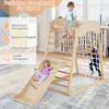 Children playing on a wooden climbing frame with a slide and net in a room. Produktbild-Vorschau