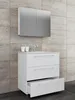A white bathroom vanity with three drawers and a mirrored cabinet above it, set against a tiled wall. Produktbild-Vorschau