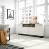 A modern living room with a white sideboard featuring an electric fireplace, large windows, and a framed picture of the Eiffel Tower. Produktbild-Vorschau
