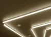 Several linear LED lights are installed on a dark ceiling. Produktbild-Vorschau