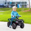 A young child is riding a green toy ATV on a paved path in a park-like setting. Náhled obrázku produktu
