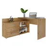 A wooden corner computer desk with drawers and shelves, a laptop, a plant, and a sculpture.