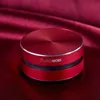 A red, circular Dura MOBI Bluetooth speaker is shown on a red satin fabric background. Náhled obrázku produktu