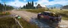 A pickup truck drives down a dirt road past mailboxes, with a farm and mountains in the background. Produktbild-Vorschau