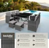 A rattan garden furniture set is arranged around a table by a swimming pool with palm trees in the background. Náhled obrázku produktu