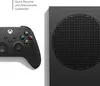 A black Xbox controller and a portion of an Xbox Series S console are shown side-by-side against a white background. Produktbild-Vorschau